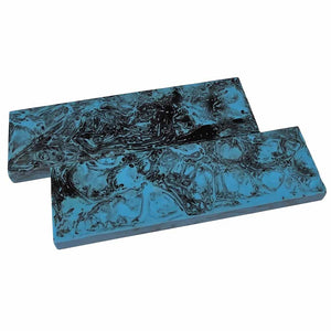 Two blue marbled rectangular objects on a white background